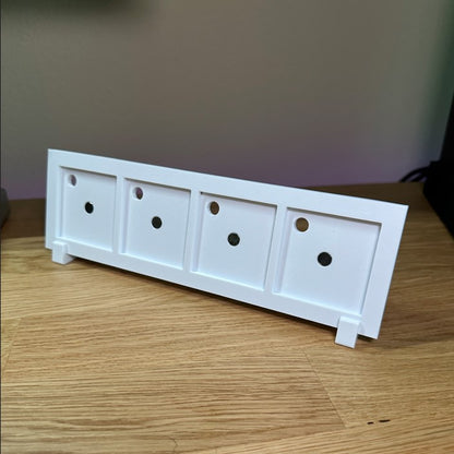 Back view of white 4-slot photo frame showing stand and structure