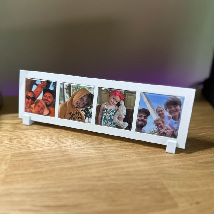 Custom horizontal photo frame with 4 family pictures on a wooden table