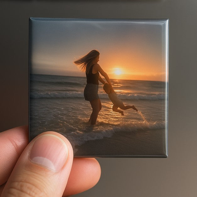 Close-up of hand holding a custom square photo magnet showing high-quality glossy print