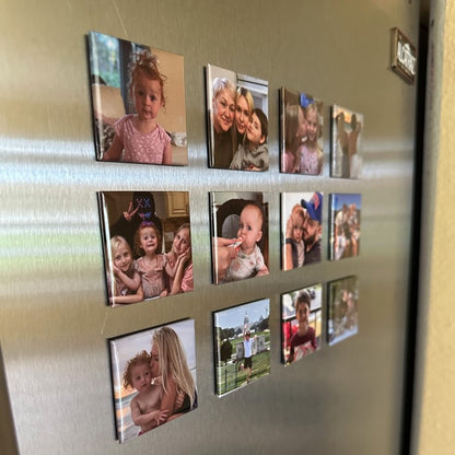 Set of 12 custom square photo magnets on a stainless steel fridge